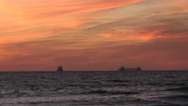HUNTINGTON BEACH CALIFORNIA-2020: Two Large Ships On The Horizon With Waves