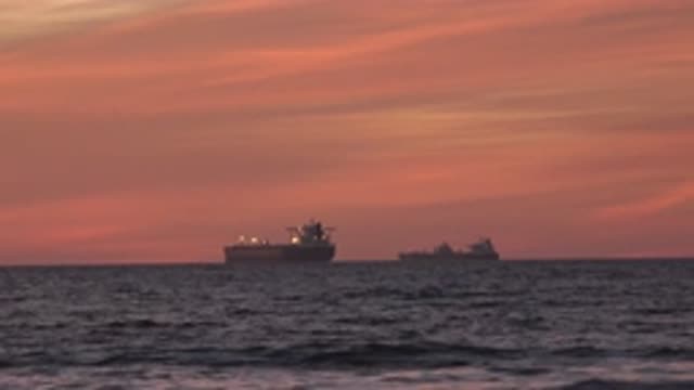 HUNTINGTON BEACH CALIFORNIA-2020: Two Cargo Ships Sailing During A Beautiful Sunset