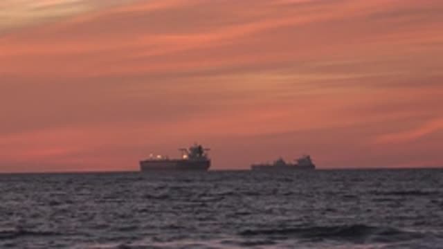 HUNTINGTON BEACH CALIFORNIA-2020: Two Ships Float Near One Another On Calm Seas