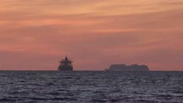 HUNTINGTON BEACH CALIFORNIA-2020: Two Small Vessels Are On The Immense Sea In