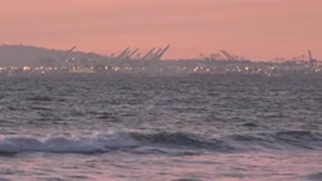 HUNTINGTON BEACH CALIFORNIA-2020: Waves On A Beach Against The Backdrop Of