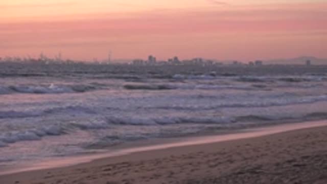 HUNTINGTON BEACH CALIFORNIA-2020: Many Waves Are Flapping Into A Large Beach In