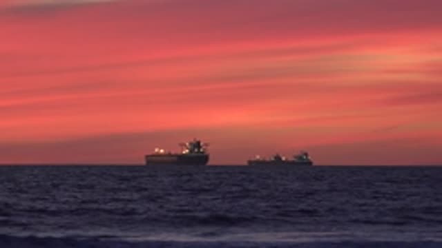 HUNTINGTON BEACH CALIFORNIA-2020: Two Freighter Ships On The Middle Of An Ocean