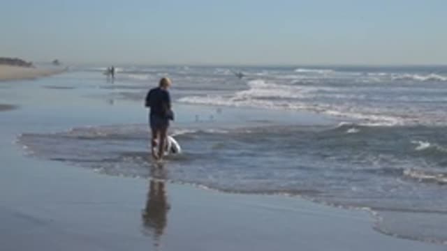 HUNTINGTON BEACH CALIFORNIA-2020: My Granddaughter Playing at the Beach