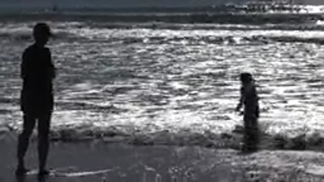 HUNTINGTON BEACH CALIFORNIA-2020: Mother And Child Enjoying Beautiful Sunny Day