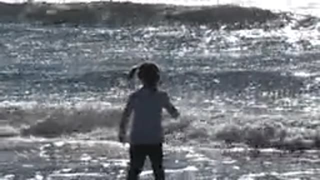HUNTINGTON BEACH CALIFORNIA-2020: The Inevitable Happiness Of A Child Playing On