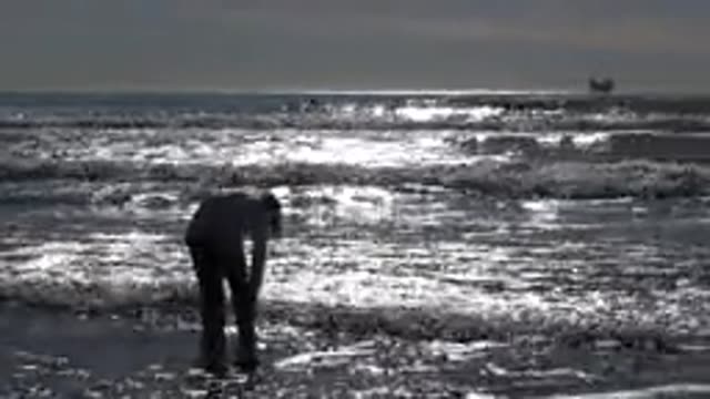HUNTINGTON BEACH CALIFORNIA-2020: Young Girl Jumping By The Seashore As Waves