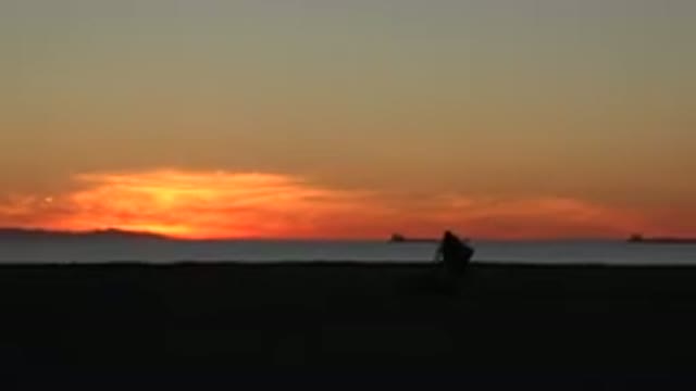 HUNTINGTON BEACH CALIFORNIA-2020: Man Cleaning The Beach At The End Of The Day