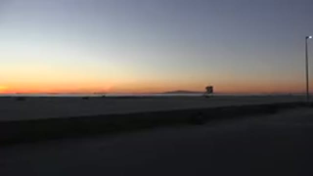 HUNTINGTON BEACH CALIFORNIA-2020: The Yellow And Orange Coloured Sky At Dusk