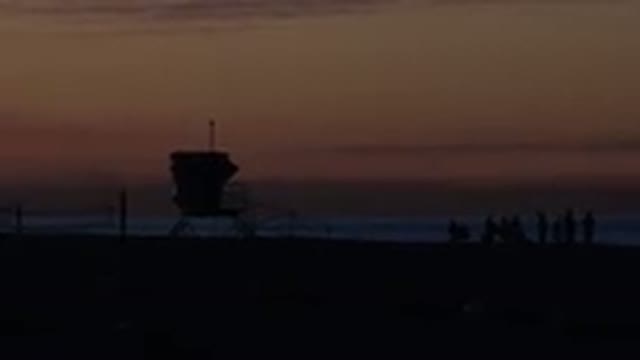 HUNTINGTON BEACH CALIFORNIA-2020: Footage Of Group Of Surfers Chilling In A