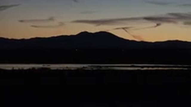 HUNTINGTON BEACH CALIFORNIA-2020: Cars Passing On A Mountain Highway Near Dusk