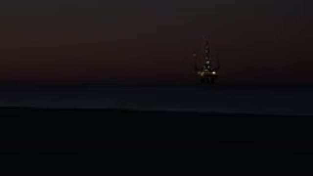 HUNTINGTON BEACH CALIFORNIA-2020: Dark Beach Sea Ship Sand Night Lights Water