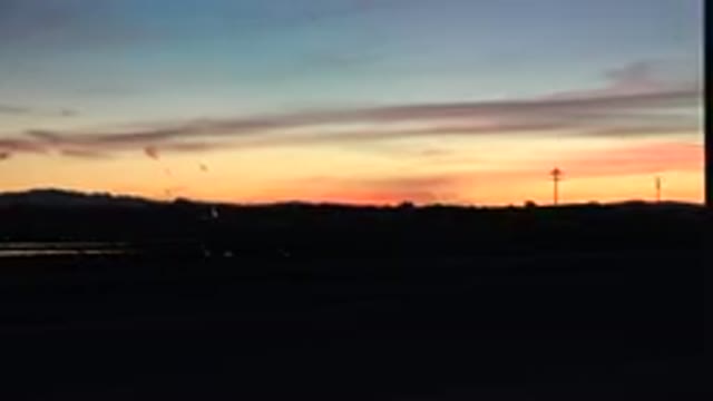 HUNTINGTON BEACH CALIFORNIA-2020: View Of Blue And Gold Sunset On A Clear Day