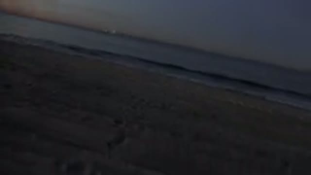 HUNTINGTON BEACH CALIFORNIA-2020: View Of Small Blue Ocean Waves Crashing On Tan