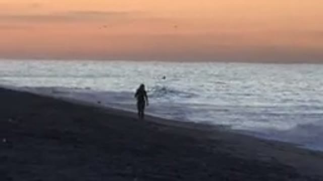 HUNTINGTON BEACH CALIFORNIA-2020: People Enjoying Evening Walk In The Beach With