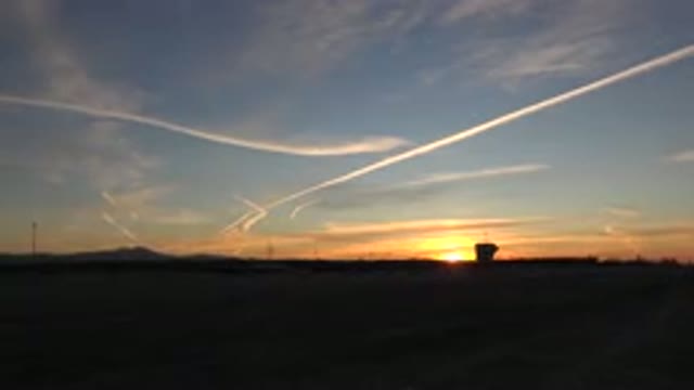 HUNTINGTON BEACH CALIFORNIA-2020: View Of Gold Sunset And Thin White Clouds On A