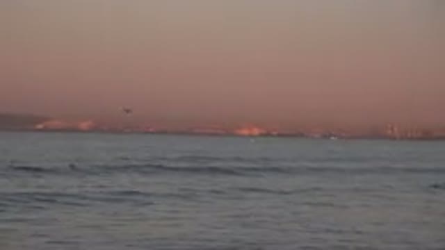 HUNTINGTON BEACH CALIFORNIA-2020: A Morning Breeze Blows Ocean Waves On To The Shore