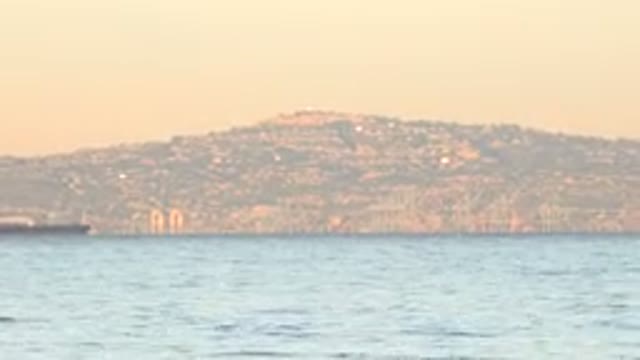 HUNTINGTON BEACH CALIFORNIA-2020: View Of Brown Mountain And Blue Ocean Water On