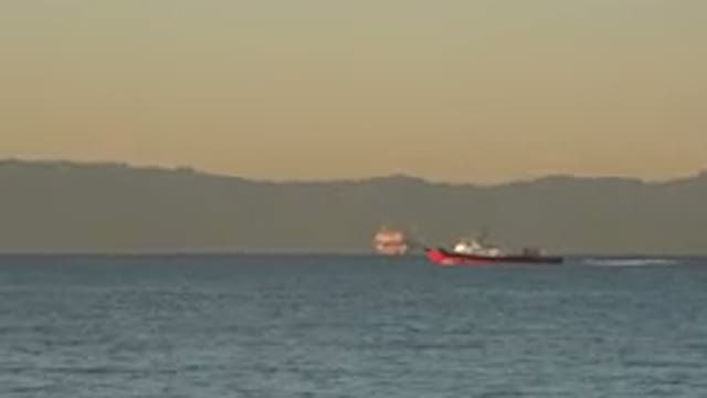 HUNTINGTON BEACH CALIFORNIA-2020: Boat Navigating The River With Another