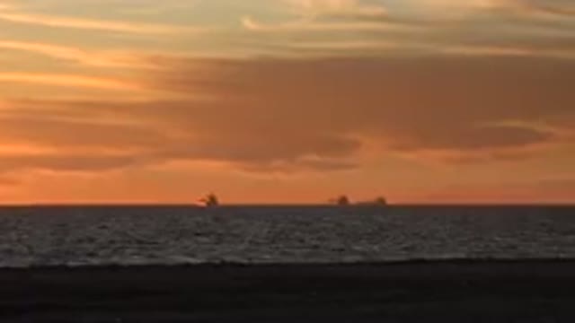 HUNTINGTON BEACH CALIFORNIA-2020: Beach Sunset Golden Hour Sky Cloud Orange Sea