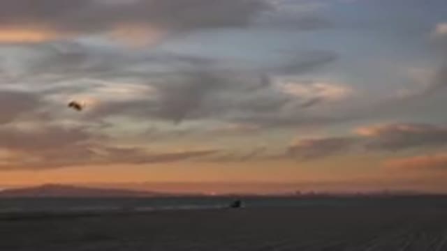 HUNTINGTON BEACH CALIFORNIA-2020: Flying A Kite On A Clear Afternoon Where
