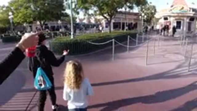 DISNEYLAND CALIFORNIA-2020: Mother And Two Kids Walking Near Row At Disneyland