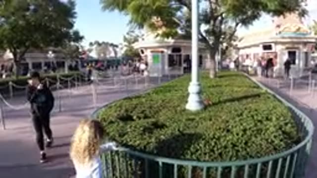 DISNEYLAND CALIFORNIA-2020: Children Playing in a Beautiful Park with Poles and Plants