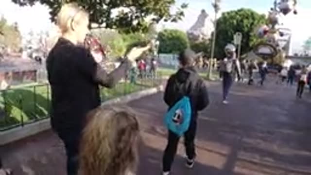 DISNEYLAND CALIFORNIA-2020: Woman Wearing Black Jacket Walks With Two Kids