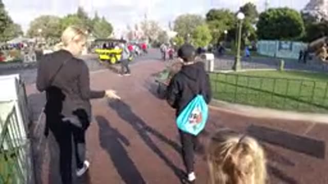 DISNEYLAND CALIFORNIA-2020: Mother Walks With Her Son At Disney World