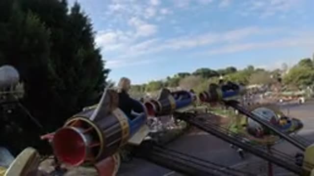 DISNEYLAND CALIFORNIA-2020: People Are Having Fun In The Park On A Rocket-Shaped Ride