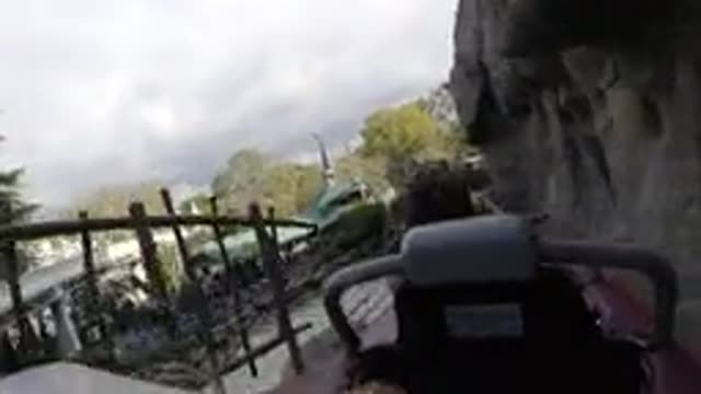 DISNEYLAND CALIFORNIA-2020: Girl Wearing Blue Shirt Rides Roller Coaster On A Clear Day