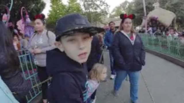 DISNEYLAND CALIFORNIA-2020: Kids Little Boy Girl Adults Crowd Queue Chewing Gum