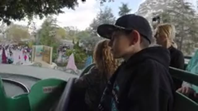 DISNEYLAND CALIFORNIA-2020: A Boy, Adult Woman, and Little Girl on a Roller Coaster