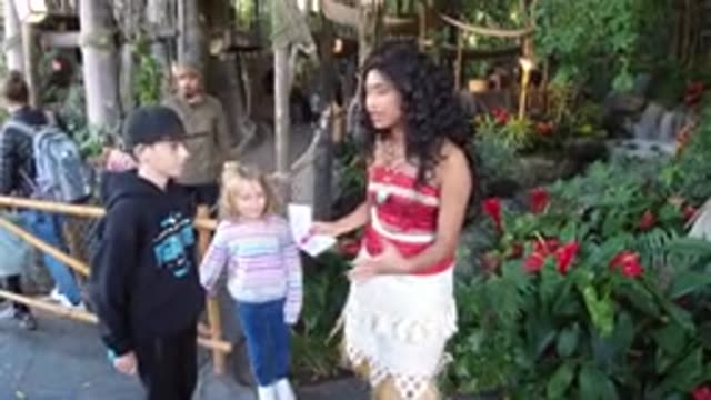 DISNEYLAND CALIFORNIA-2020: Woman Dressed As Moana Talks To Children At Amusement Park