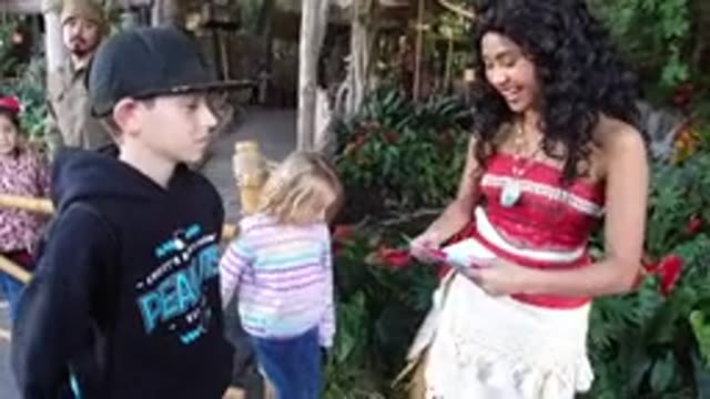 DISNEYLAND CALIFORNIA-2020: A Girl Gives a Boy a Paper and Pen