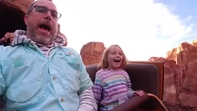 DISNEYLAND CALIFORNIA-2020: Father And Daughter Riding A Roller Coaster