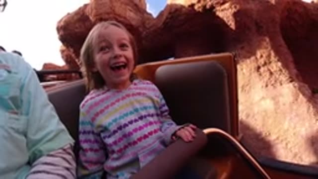 DISNEYLAND CALIFORNIA-2020: Happy Little Girl Riding A Rollercoaster With Her Dad