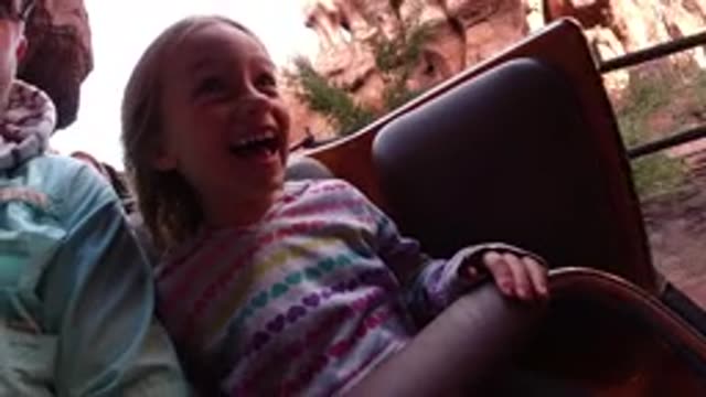 DISNEYLAND CALIFORNIA-2020: A Little Girl Is Happy And Has A Bright Smile While Riding