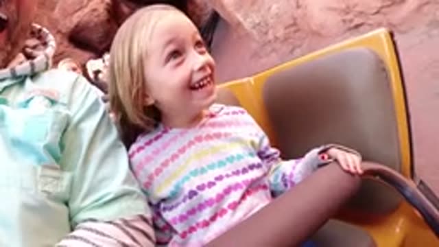DISNEYLAND CALIFORNIA-2020: Young Blond Girl Excitedly Rides Roller Coaster