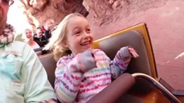 DISNEYLAND CALIFORNIA-2020: Girl on Roller Coaster Waving and Lifting Arms in Slow Motion