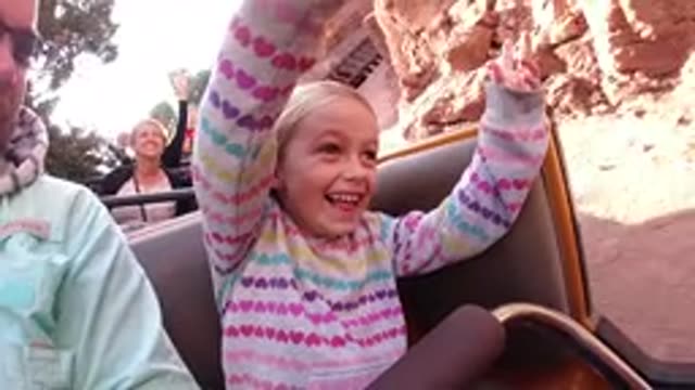 DISNEYLAND CALIFORNIA-2020: A Little Girl Enjoys A Ride At An Amusement Park