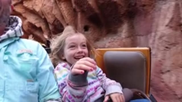 DISNEYLAND CALIFORNIA-2020: Close-Up Of Girl Smiling On Roller Coaster Ride