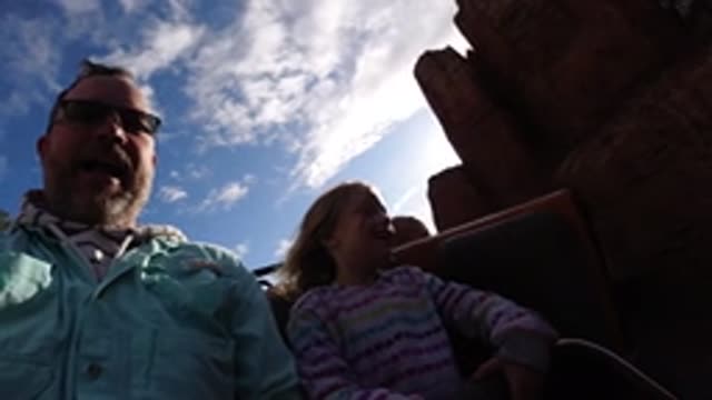 DISNEYLAND CALIFORNIA-2020: A Man With A Beard And A Girl Smile As They Go On A