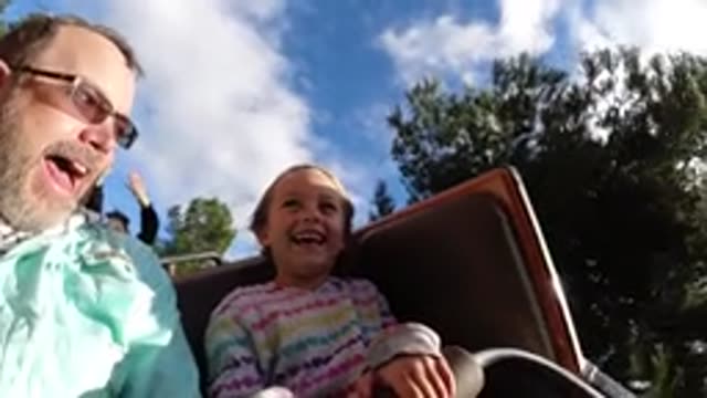 DISNEYLAND CALIFORNIA-2020: Dad And Daughter Having Fun On A Roller Coaster