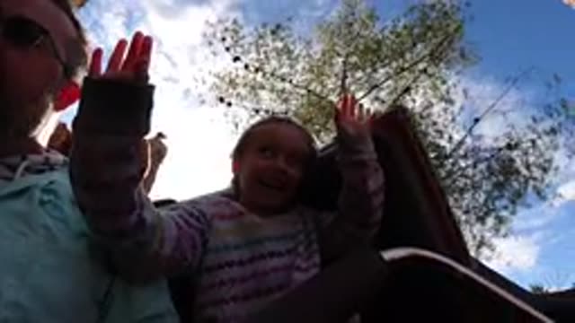 DISNEYLAND CALIFORNIA-2020: A Little Girl Raises Her Hand As She Rides A Roller Coaster