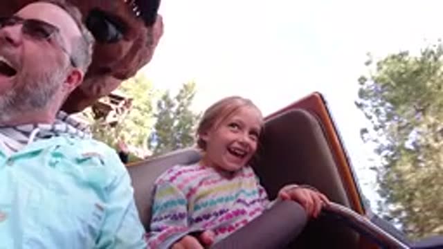 DISNEYLAND CALIFORNIA-2020: Father And Daughter Enjoying A Ride