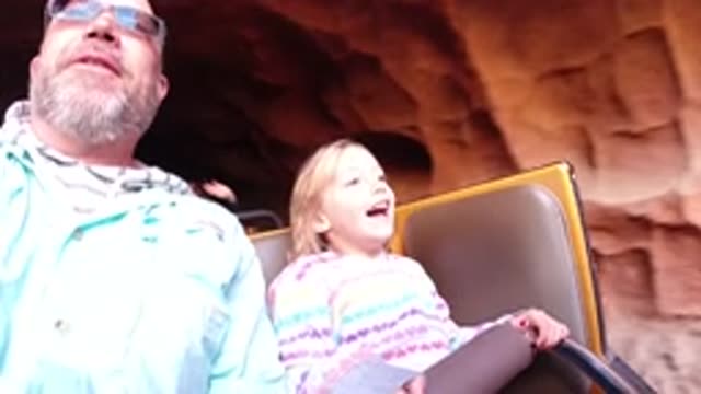 DISNEYLAND CALIFORNIA-2020: Child With His Father Enjoying A Holiday On A Roller Coaster