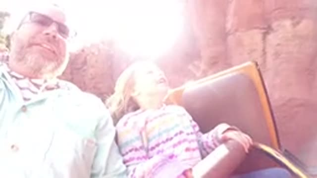 DISNEYLAND CALIFORNIA-2020: Father And Daughter Enjoy Outdoor Amusement Ride