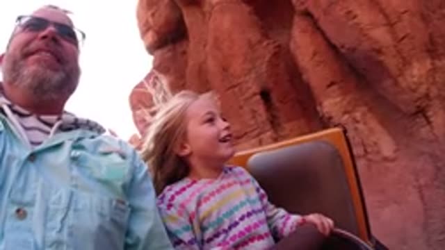 DISNEYLAND CALIFORNIA-2020: Roller Coaster Ride With Man And Little Child