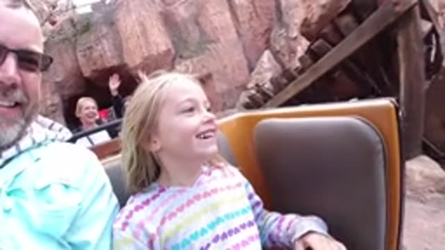 DISNEYLAND CALIFORNIA-2020: A Young White Girl Rides A Children's Themed Roller Coaster
